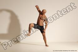 Underwear Gymnastic poses Man Black Muscular Bald Dancing Dynamic poses Academic